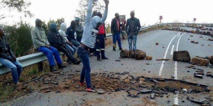 Protesters digging out the road between Pomeroy and the Mozana turn off this morning while protesting over lack of water and electricity