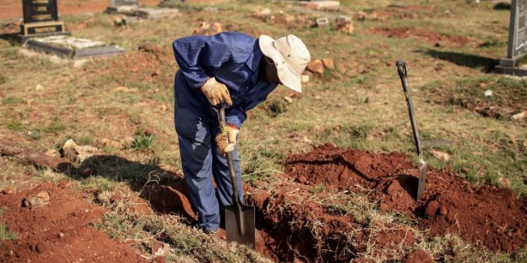 South Africa family did up grave remove plastic covid-19