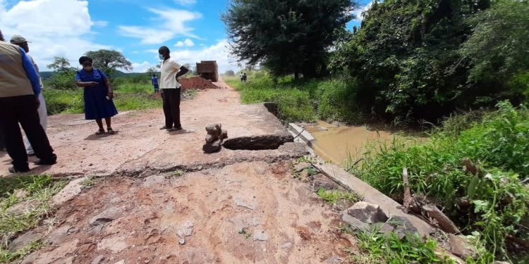 Another road collapses plunging two cars and a motorcycle into the sinkhole