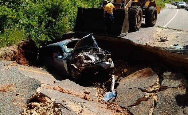 Another road collapses plunging two cars and a motorcycle into the sinkhole
