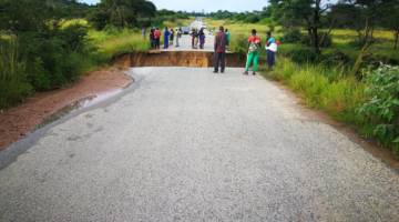 Another road collapses plunging two cars and a motorcycle into the sinkhole