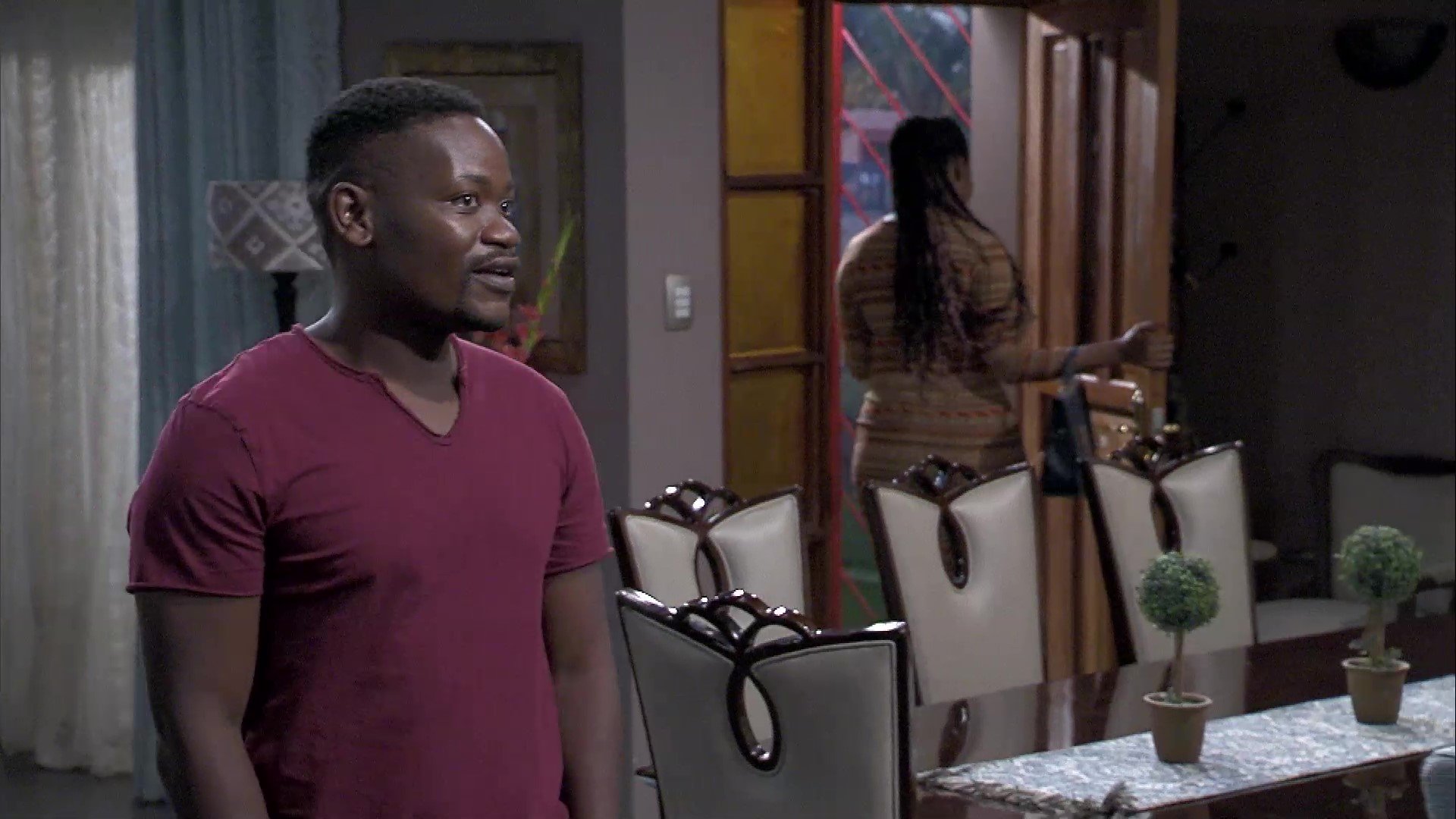 Kwaito walks in on what might appear to be a flirtatious moment between two unlikely people.