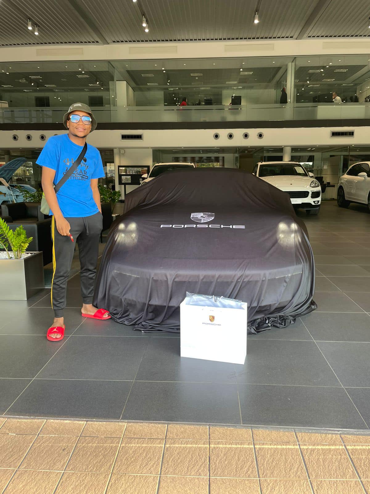 Master KG showing off his new Porsche (Source Facebook@makhadzi)