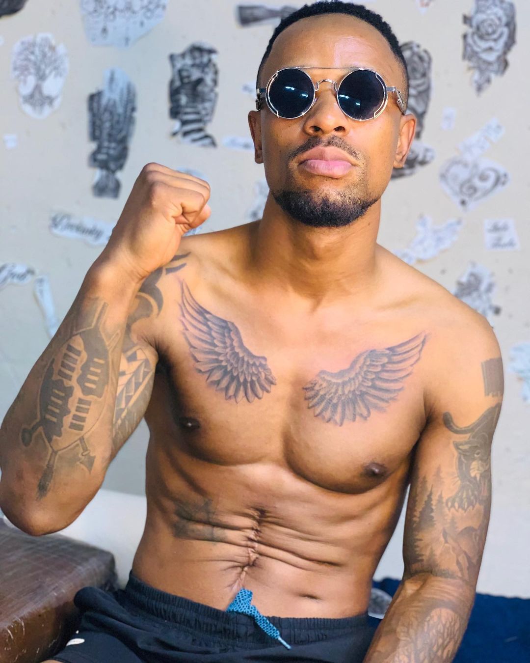 SK Khosa shows off tattoos