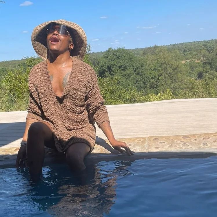 Somizi enjoys some fresh air in the pool