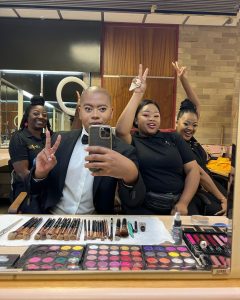 Linda Majola with his makeup team