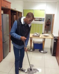 Lindah Majola mopping floors