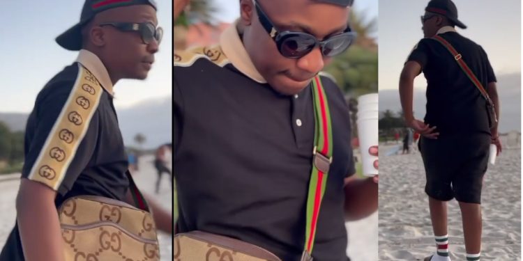 Its a Gucci day: Watch as Reece Madlisa impresses with his all Gucci outfit at the beach in Cape Town