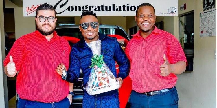 Dj Tira celebrates his new car, a Toyota Bakkie.