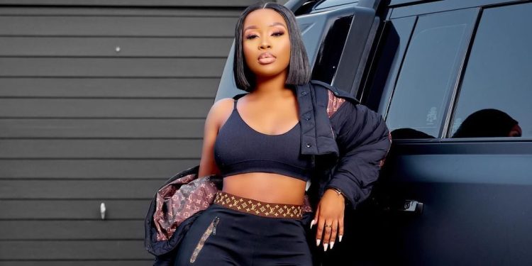 Sithelo standing next to her new car