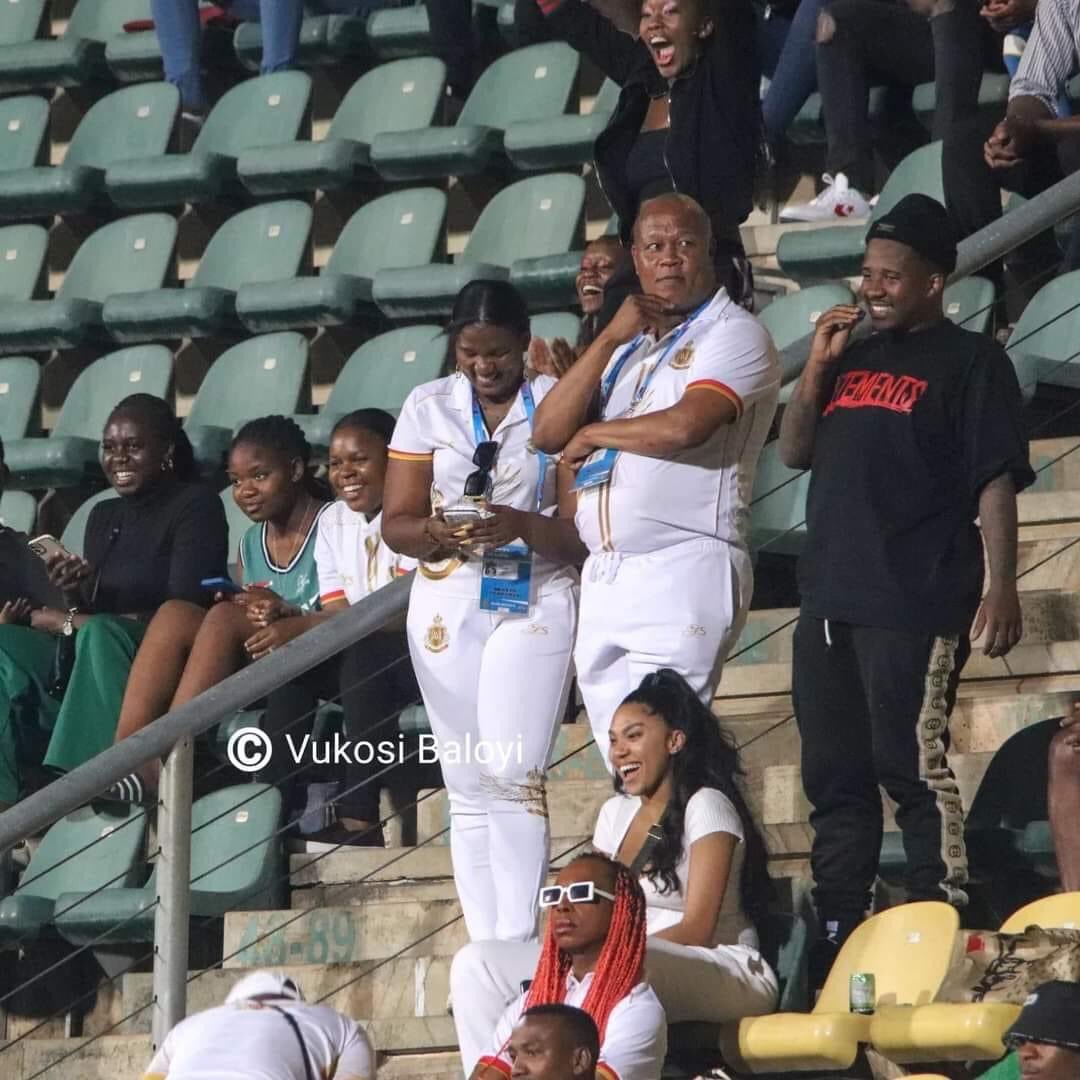 MaMkhize blushing in the stands alongside Andile and Tamia Mpise - Source: Twitter