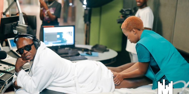 Tbo Touch interviews Zola 7 while receiving a full body massage live on air